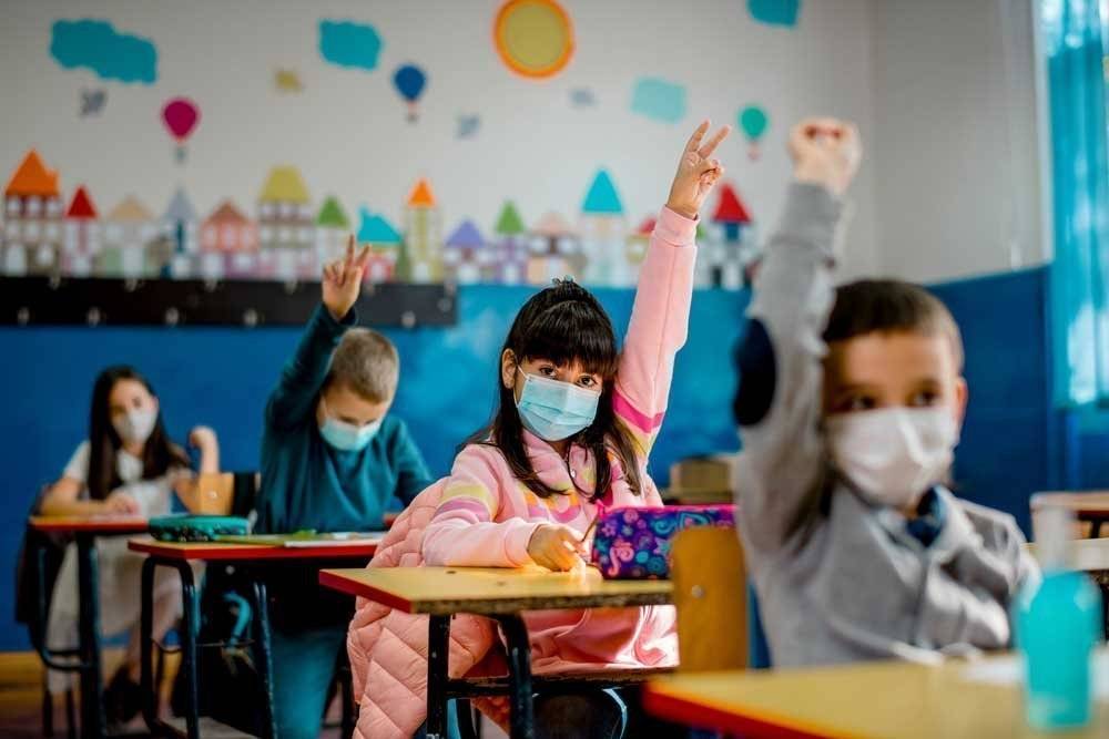 Elementary,Schoolchildren,Wearing,A,Protective,Face,Masks,In,The,Classroom.
